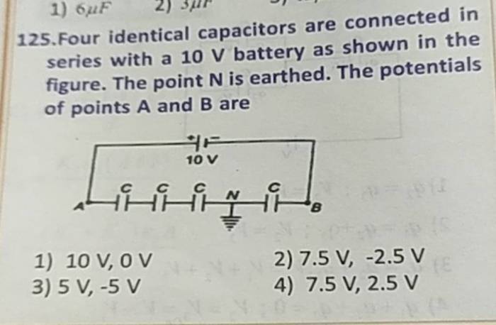 Four identical capacitors are connected